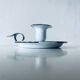 Old candle holder in white enameled metal