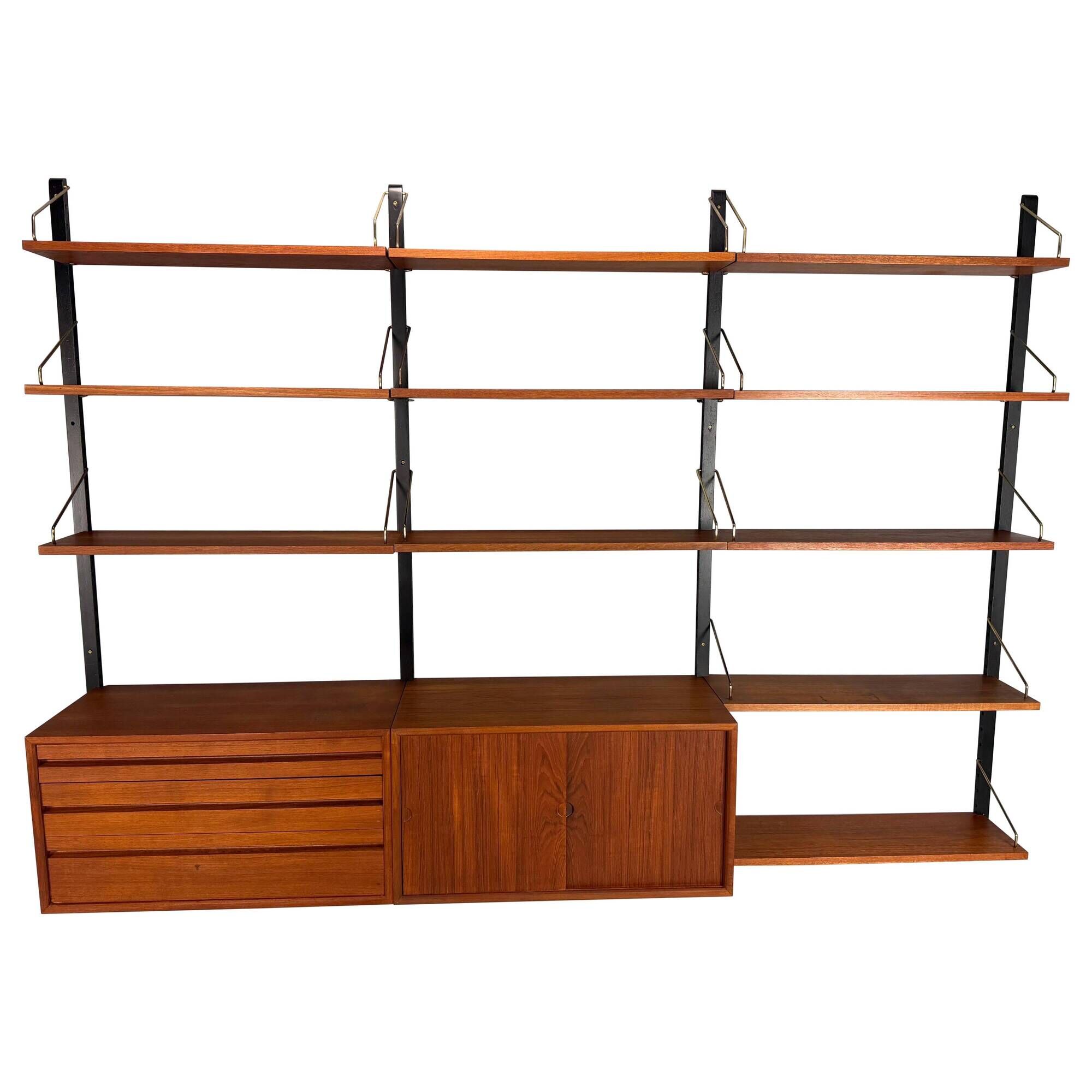 Modular wall shelf in teak in mid-century modern style, designed by Poul Cadovius for Cado, 1960.