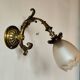 Bronze wall light with opaque glass tulip