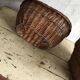 Set of 2 brown wicker baskets from the 1960s — decorative weaving and double handles.
