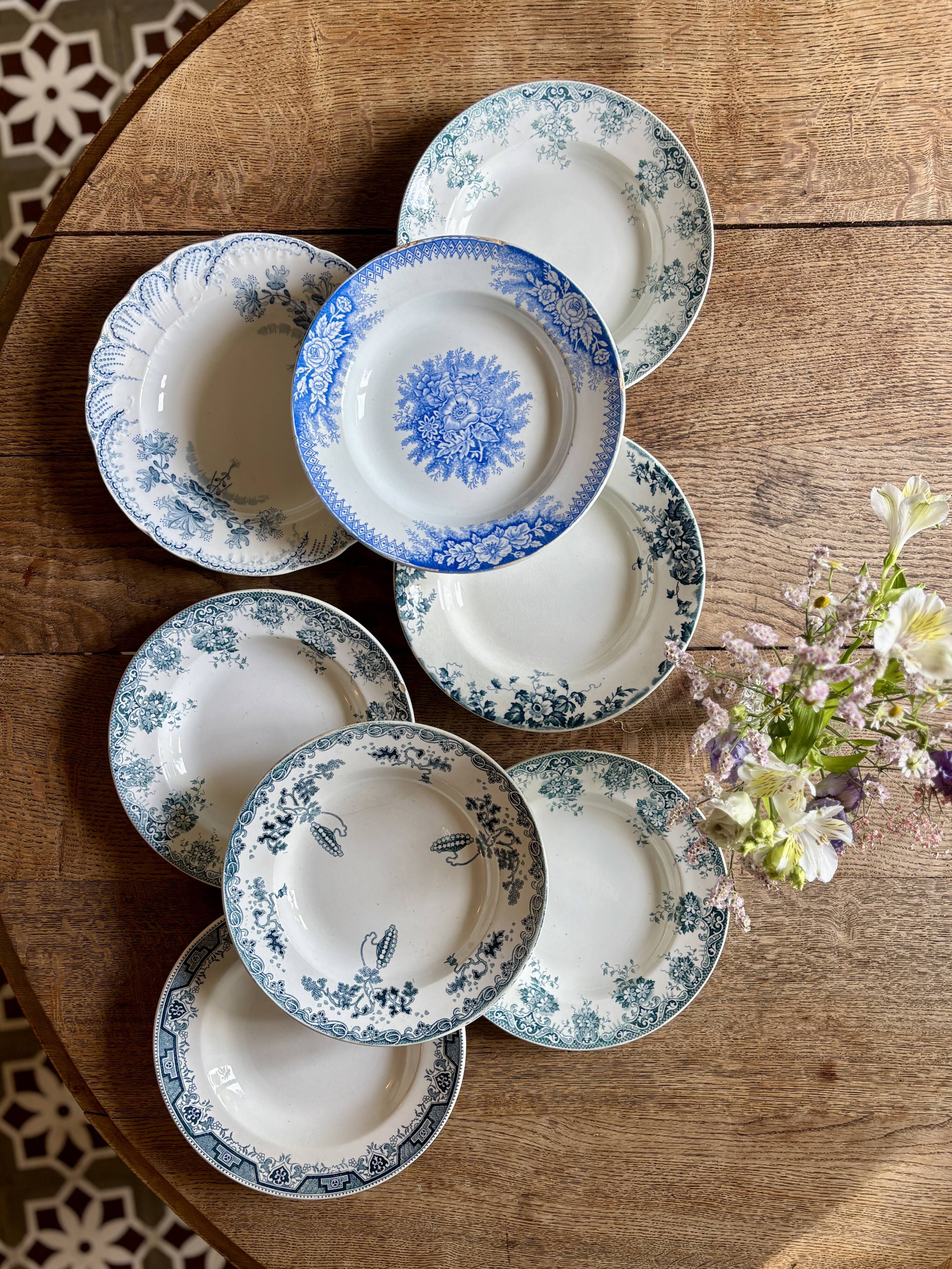 Set of 8 mismatched antique ironstone deep plates.
