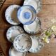 Set of 8 mismatched antique ironstone deep plates.