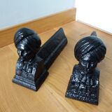 Cast iron andirons with character heads