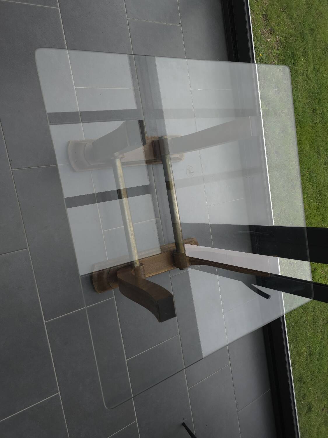 Art Deco coffee table in glass, wood, and brass.