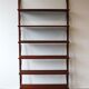 Teak and brass wall shelf by Poul Cadovius for Royal System, Denmark, 1960.