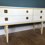 White retro wooden commode in Mid-Century style, tapered legs and gold handles (1960s)