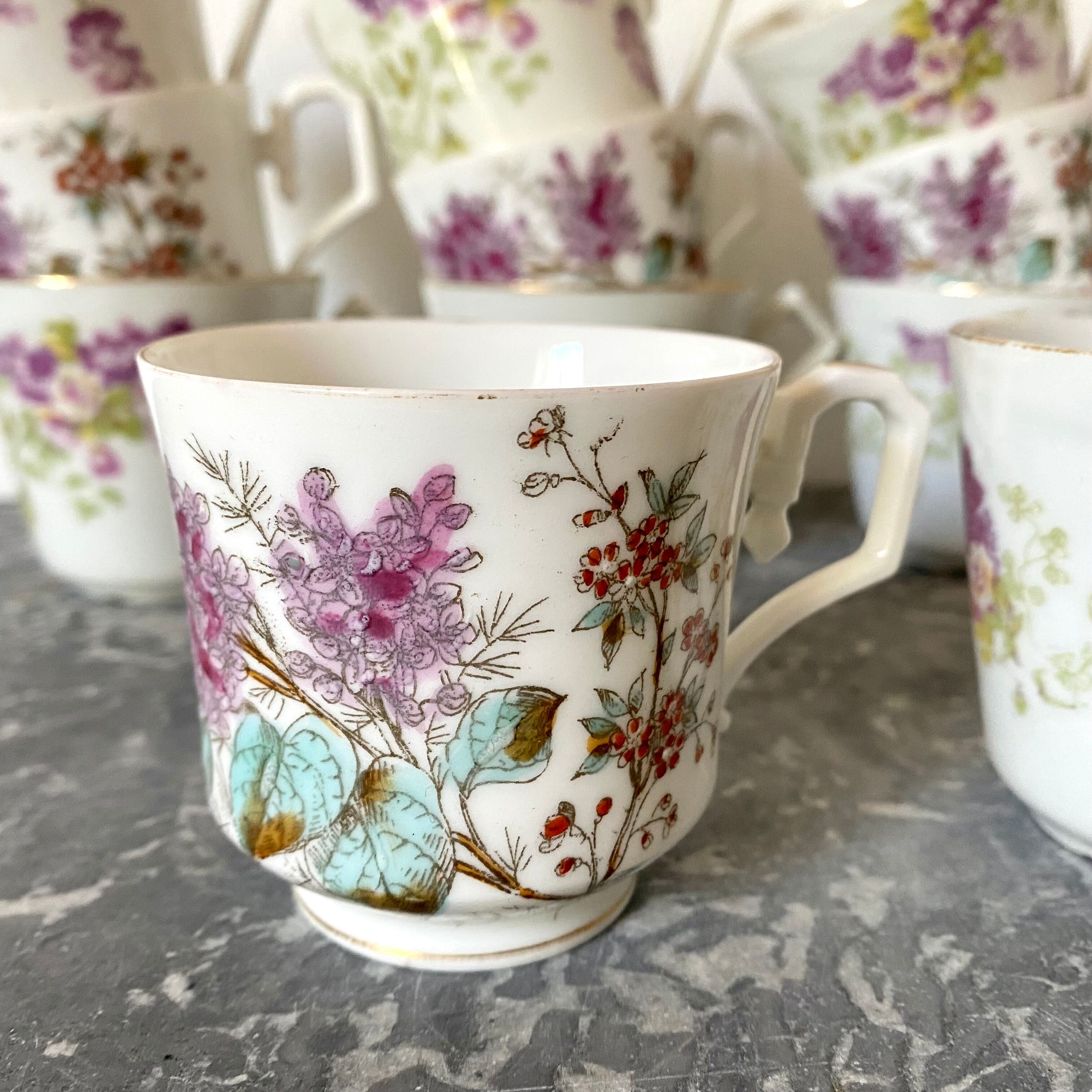Antique flowered porcelain cups mismatched