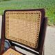 Set of 2 folding chairs in wood and cane.