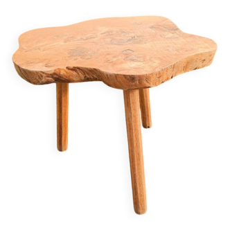 Raw wood side table in organic brutalist style