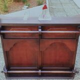 Bar counter in solid exotic teak wood; molded panel decor.