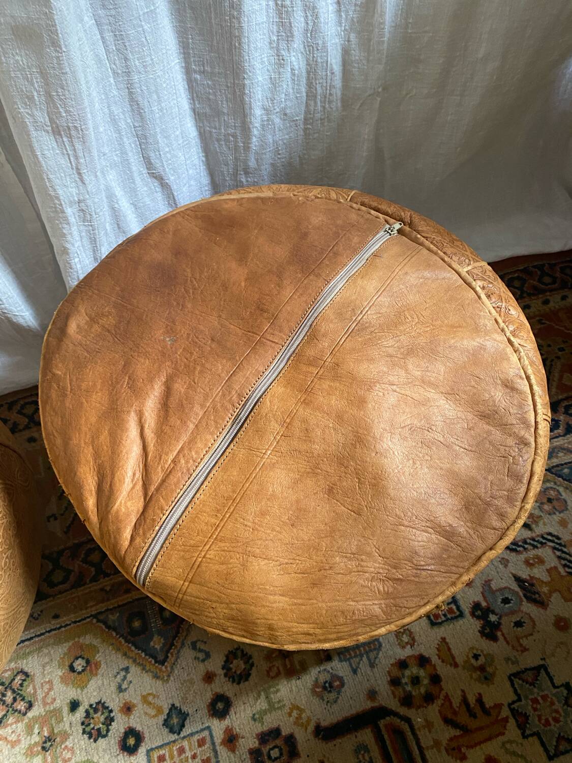 Pair of leather poufs