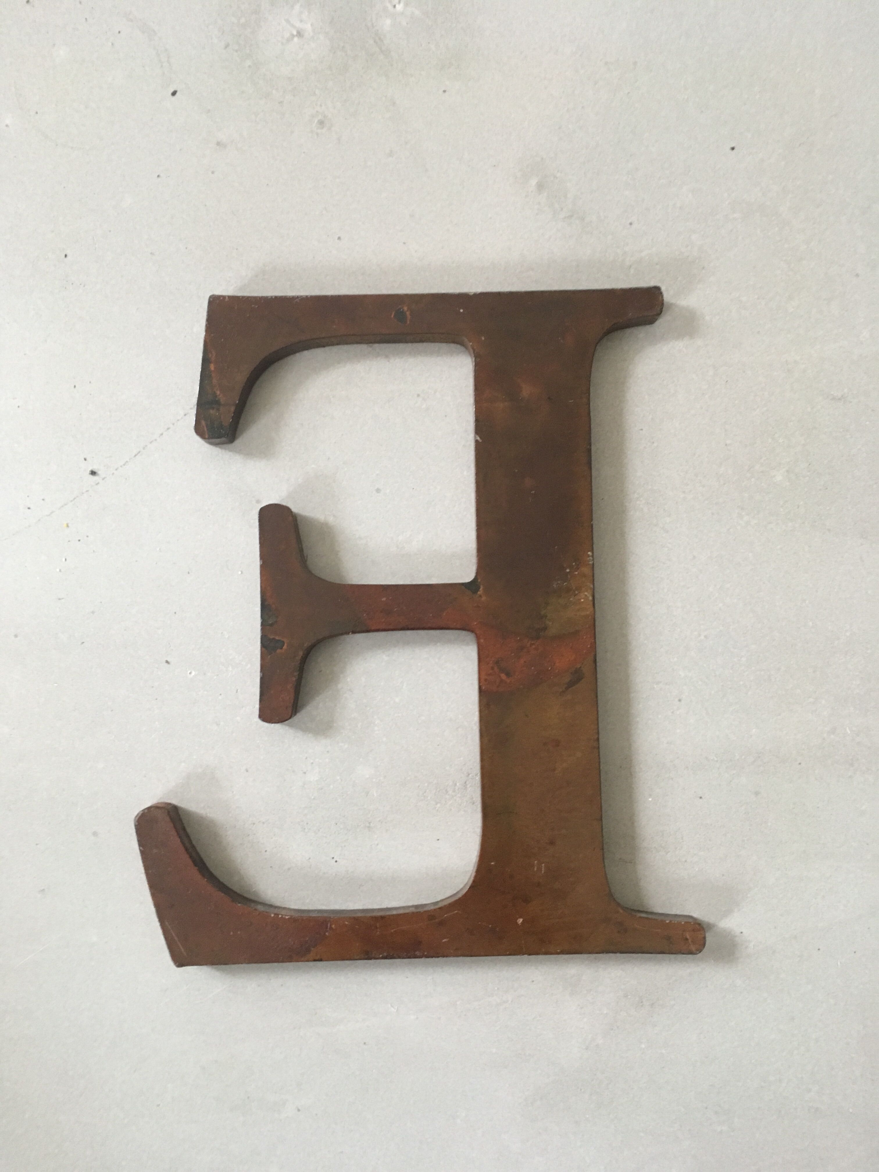 Ancient "E" sign letter