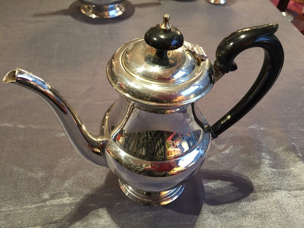 Coffee and the service in silver metal flagship