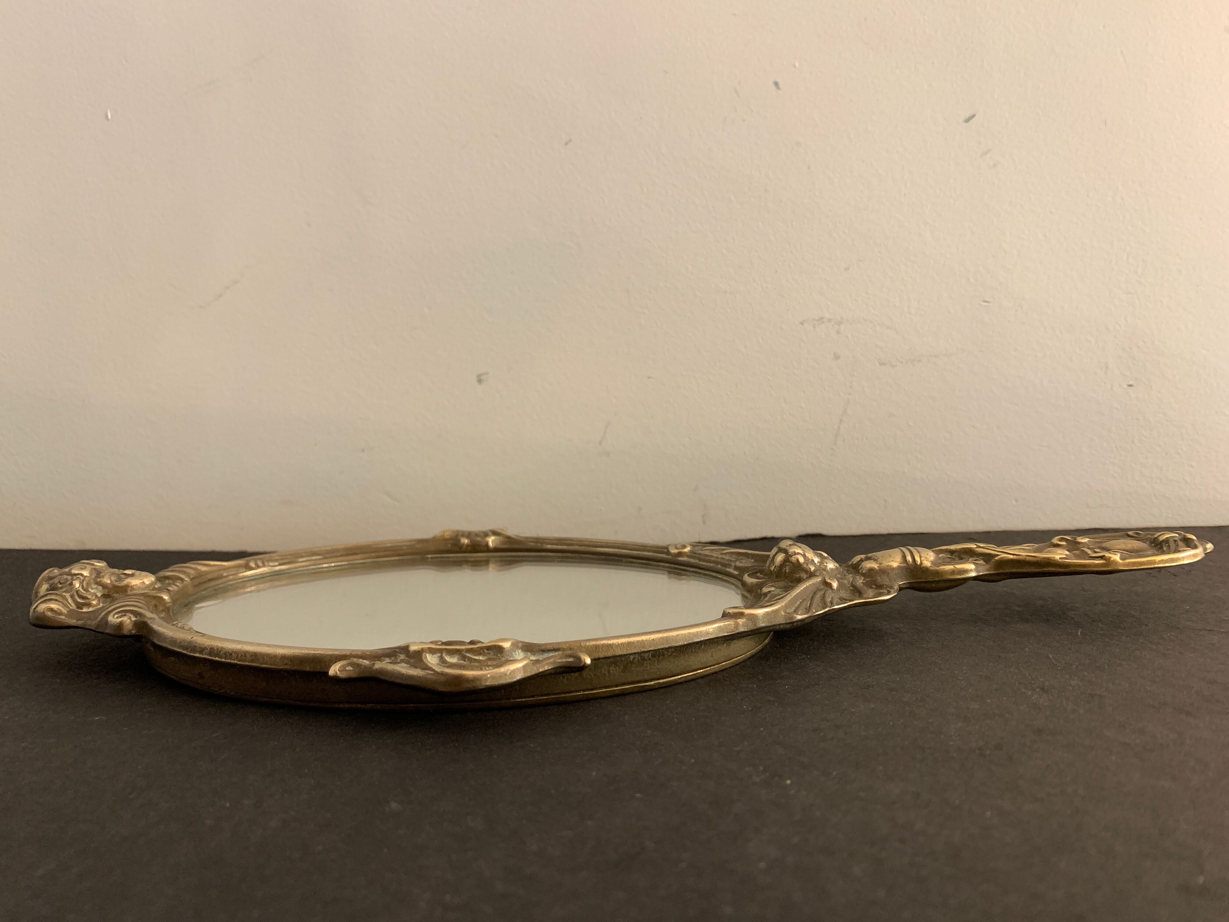 Bronze hand-facing mirror, early twentieth century, Louis XV style, 29 x 13 cm