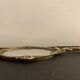 Bronze hand-facing mirror, early twentieth century, Louis XV style, 29 x 13 cm