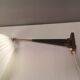 Wall lamp with adjustable ‘arm’ in copper and rosewood, with white shade.