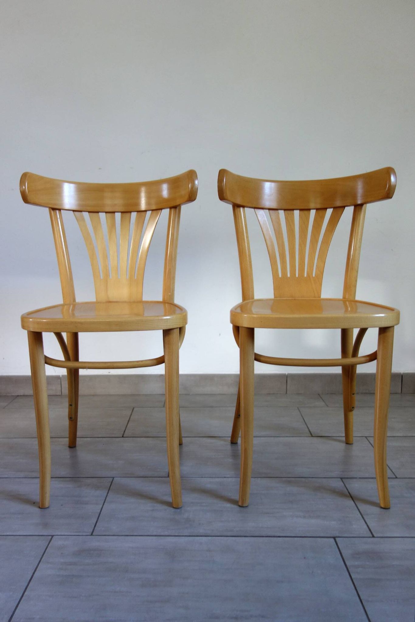 Pair of Thonet-inspired bistro chairs in light beech