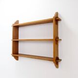 Wall shelves with dowels in Arts & Crafts style