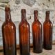 Set of 10 bottles of old Bordeaux French wine in ruby brown glass, 19th century.