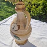 Handcrafted jug or jar with a handle, terracotta pottery vase, fat lava effect, stylized flowers