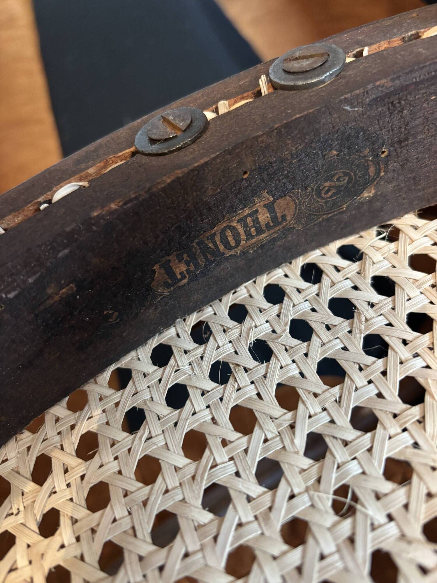 Antique Thonet bench in bent wood and caning, signed.