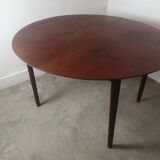 Scandinavian extendable round dining table in teak