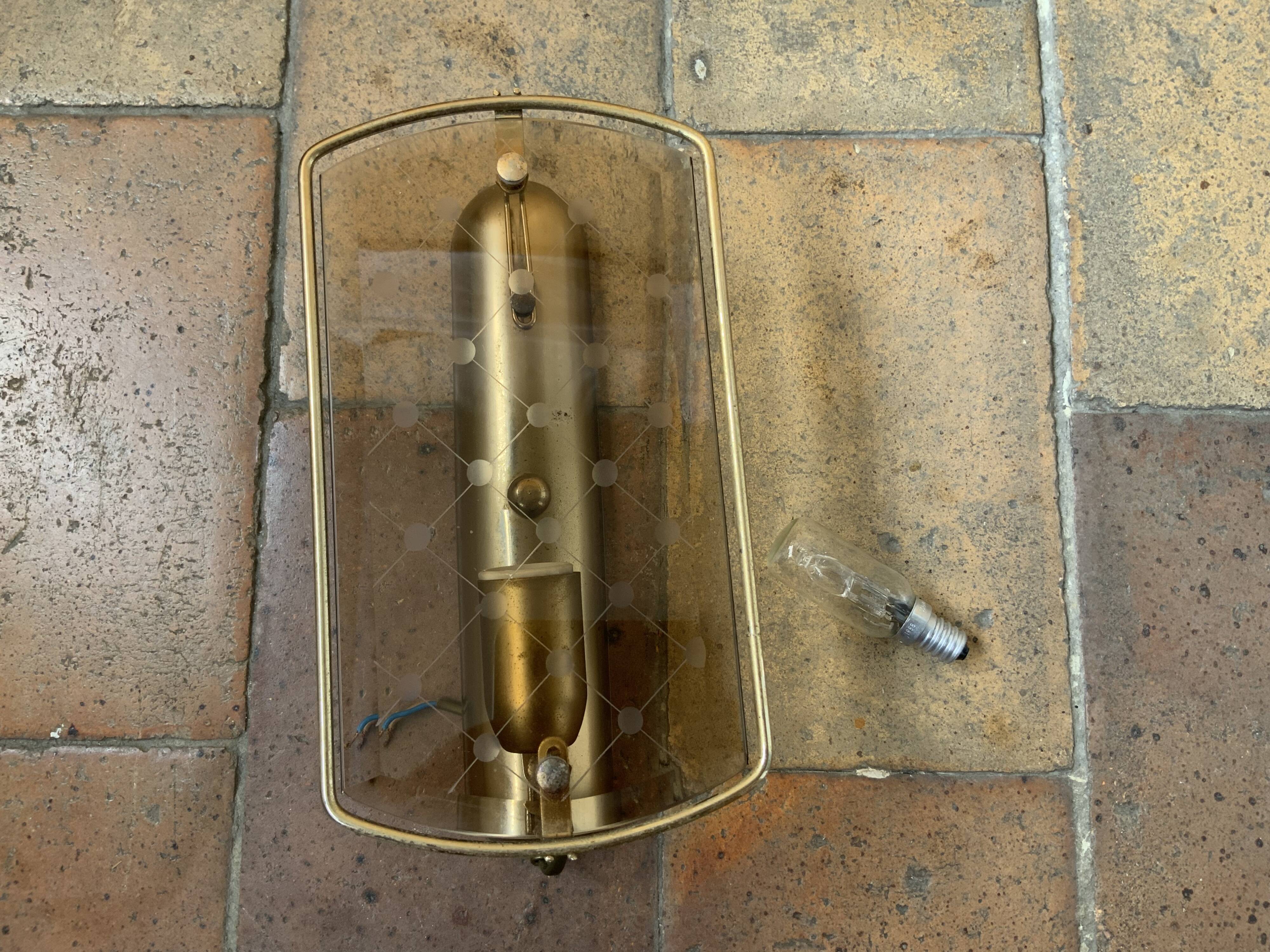 Brass wall lamp and smoked glass