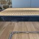 Banc en cannage, bois noir et métal chromé modèle Panchira