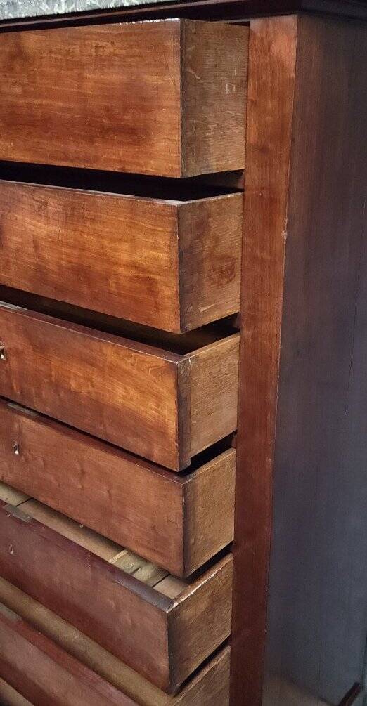 Empire Restoration period chest of drawers in mahogany, with a marble top.