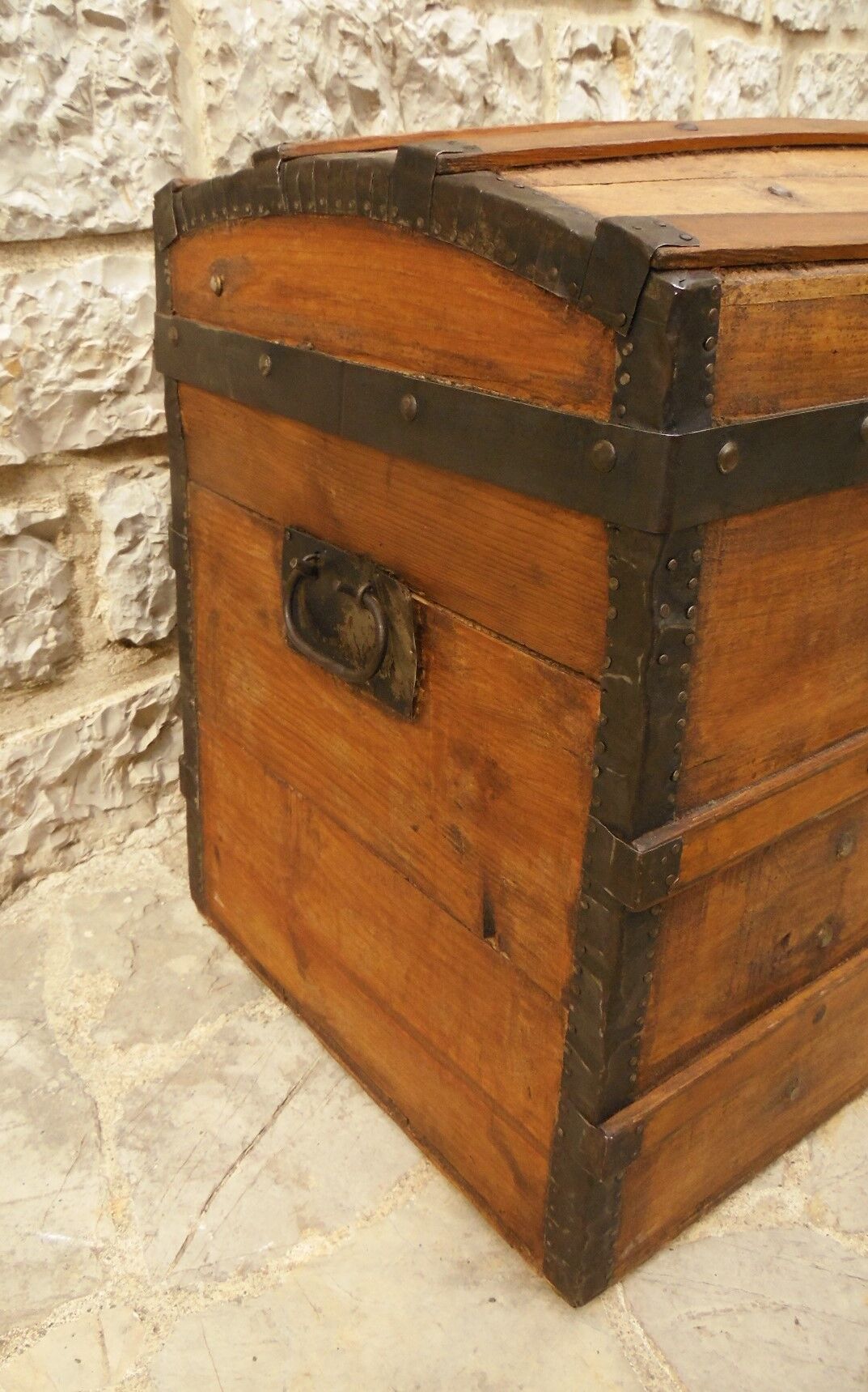 Ancient travel trunk, bulging wooden chest