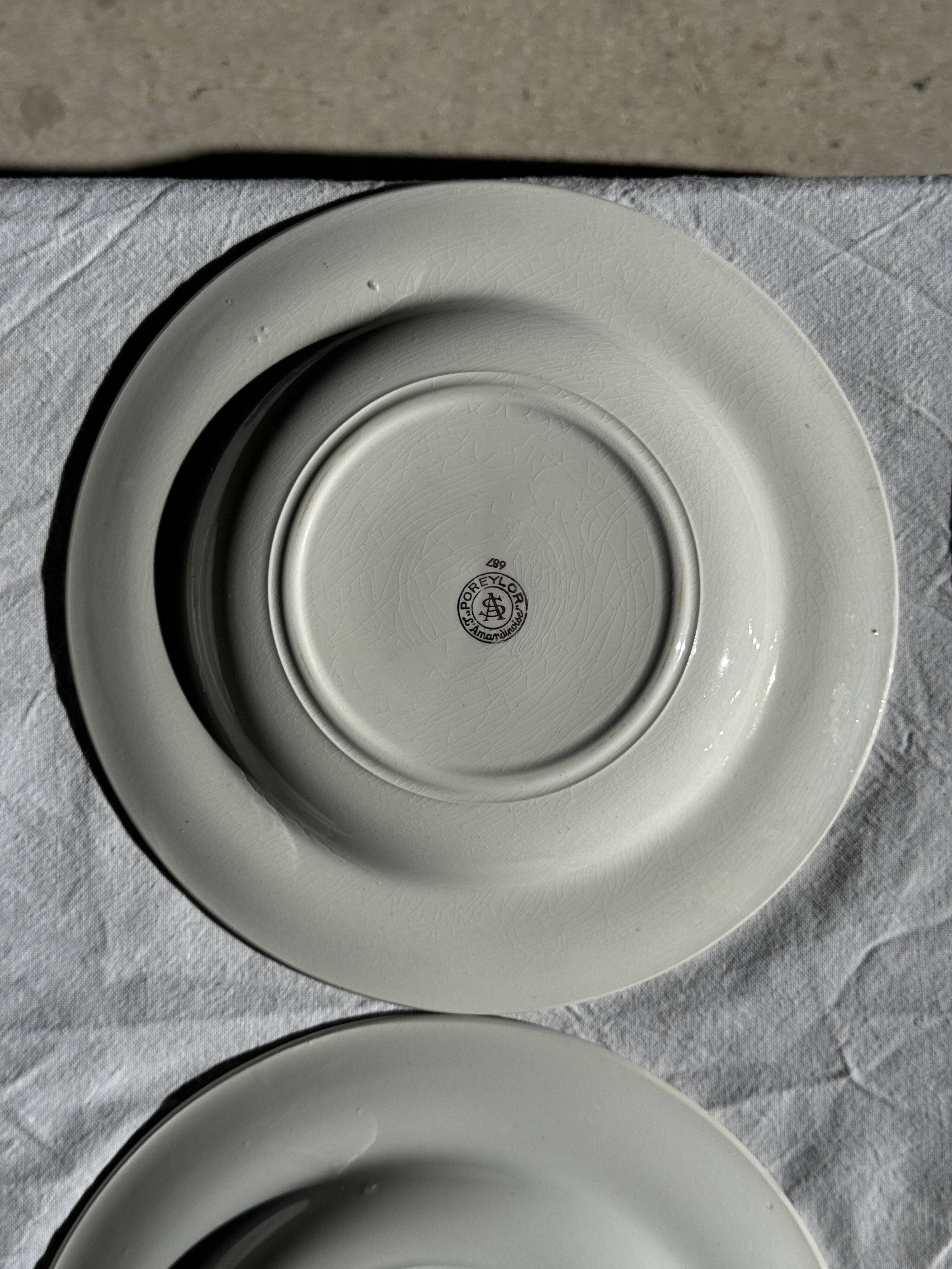 Set of 9 vintage turquoise deep plates with gold trim and pink flowers.