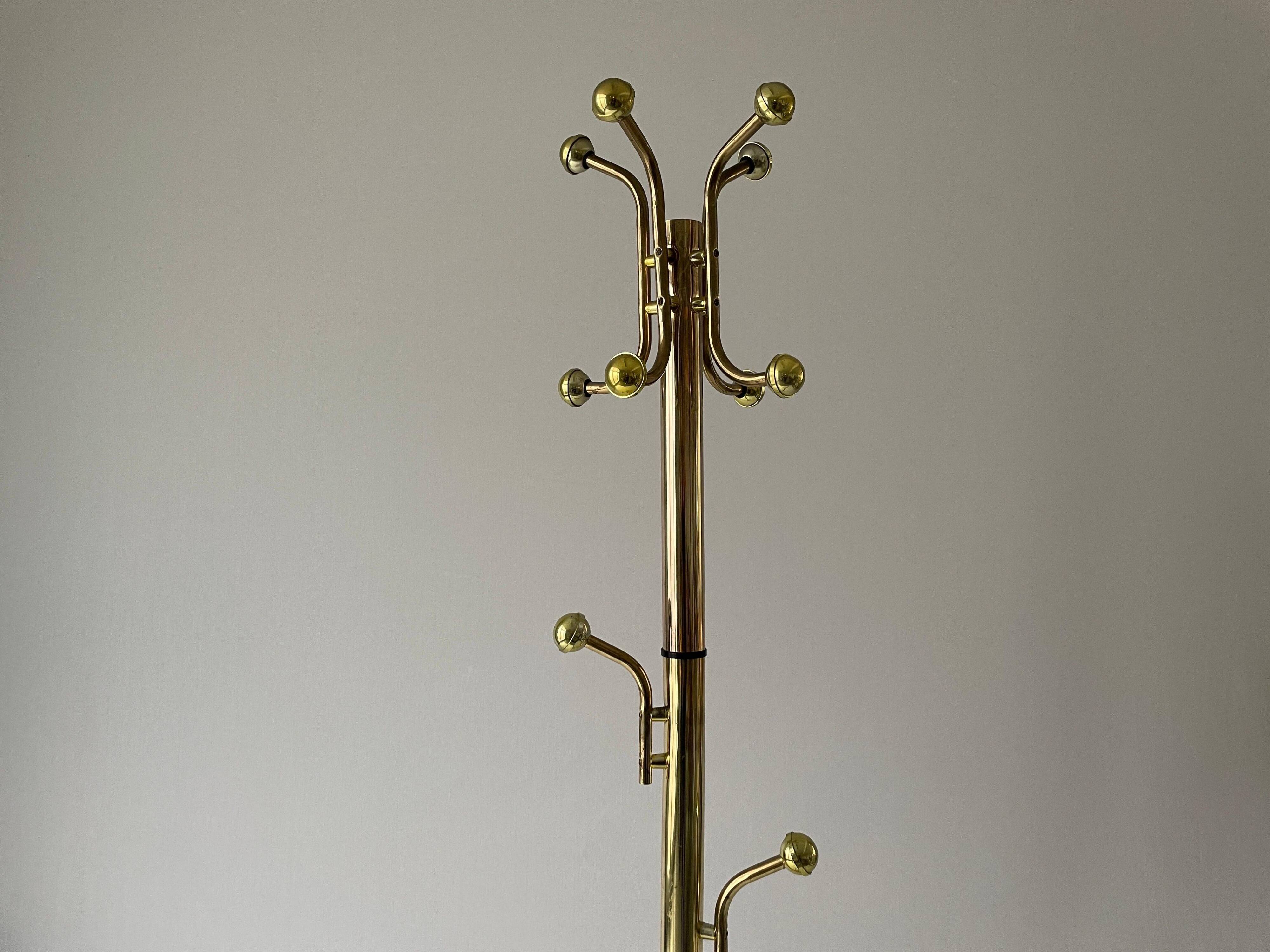 Free-standing coat rack in plexiglass with a marble base, 1960s, Germany.