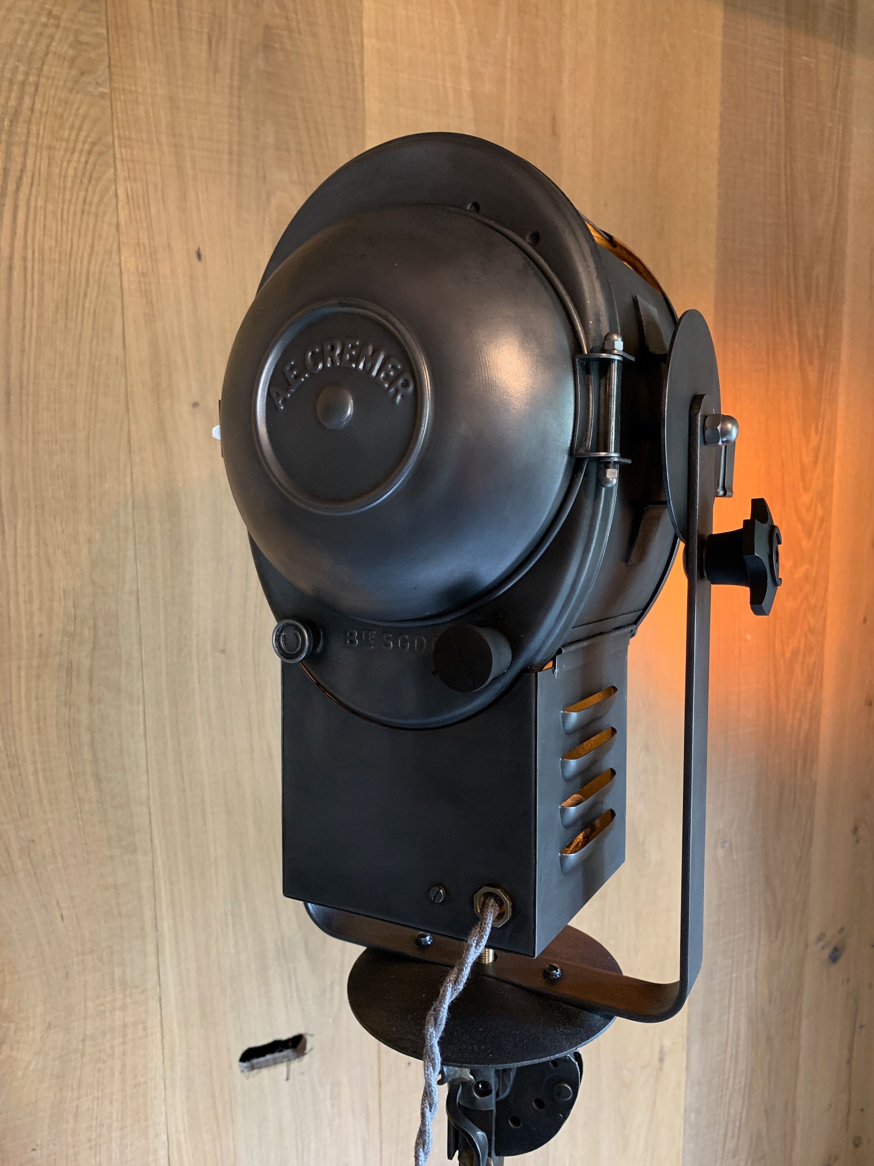Cinema projector A.E Cremer Paris on its adjustable wooden foot circa 1960