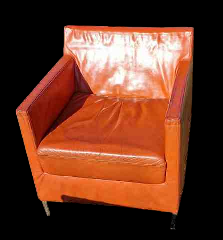 Pair of vintage orange leather armchairs