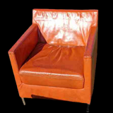 Pair of vintage orange leather armchairs