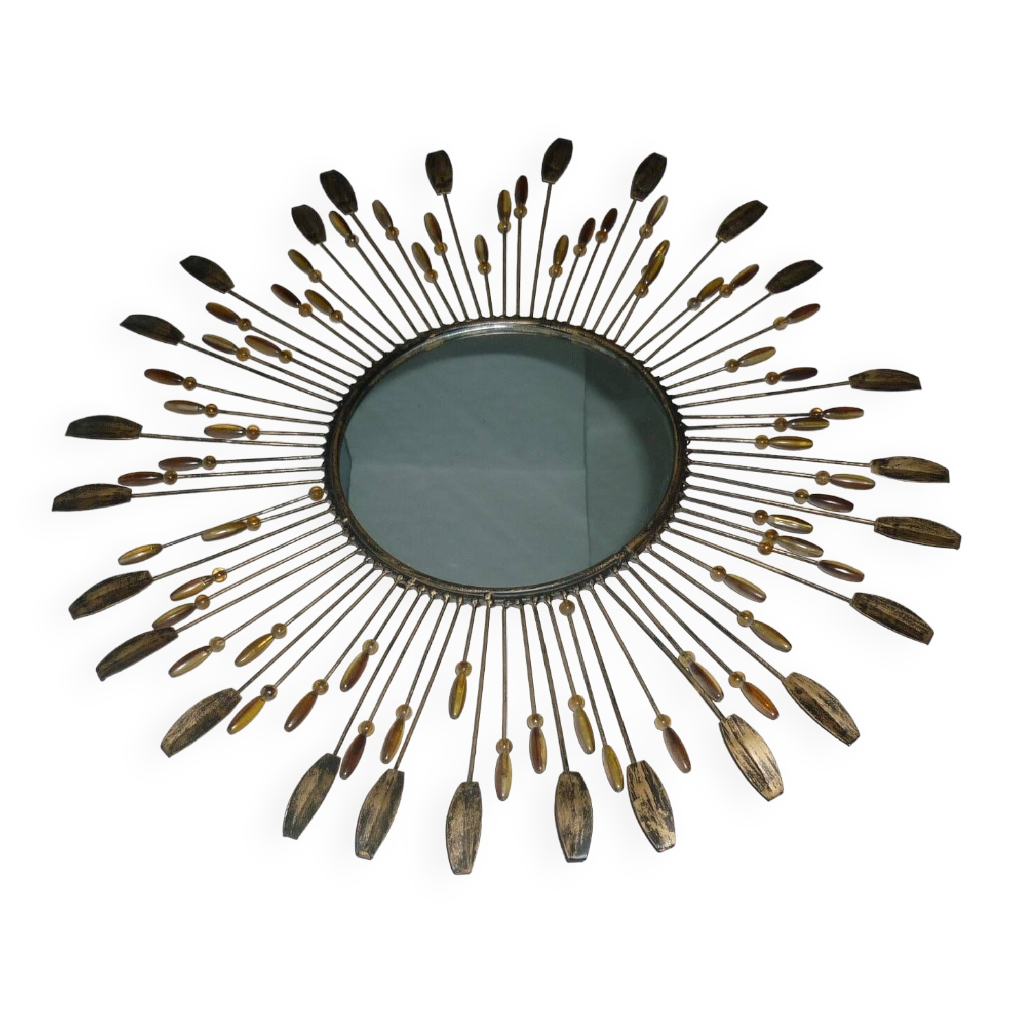 Round sun mirror with pearl rays and leaves