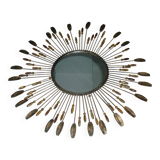 Round sun mirror with pearl rays and leaves