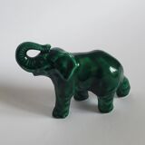 Small emerald green ceramic elephant.