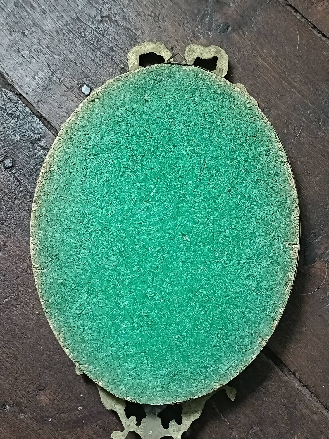 Antique mirror, oval with brass crest