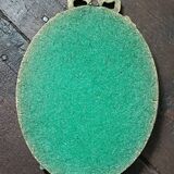 Antique mirror, oval with brass crest