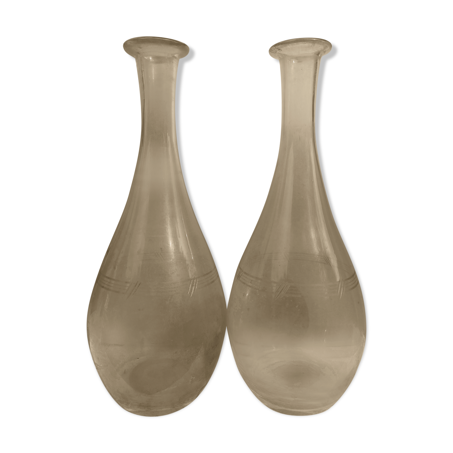 Pair of chiseled glass wine decanters