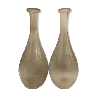 Pair of chiseled glass wine decanters