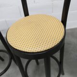 Pair of Baumann Dialog model stools in black and yellow and blue imitation leather, 1990