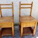 2 old wooden children's chairs with a small chest.