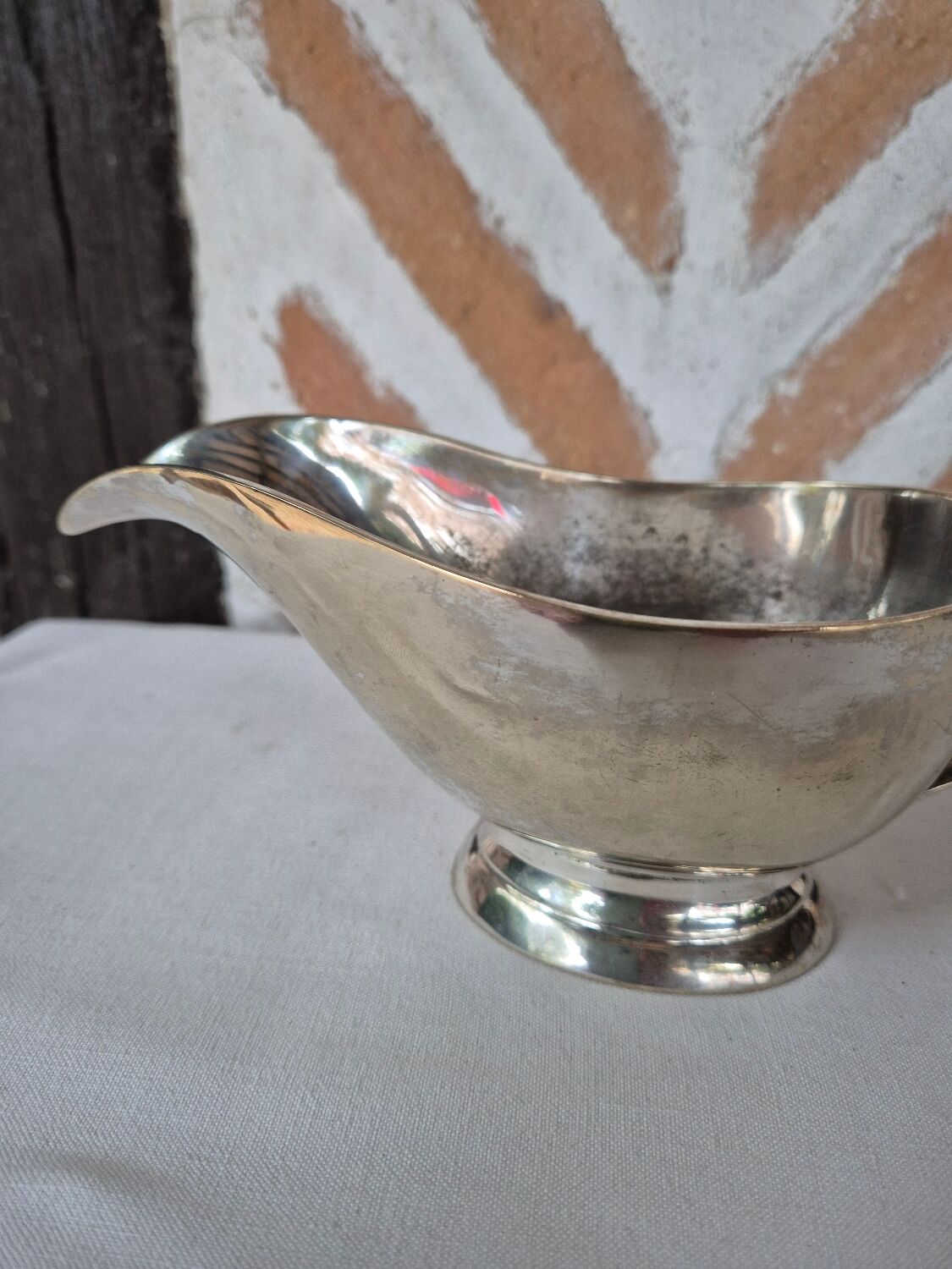 Silver-plated metal gravy boat