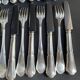 12 Forks and 12 cheese or dessert knives – Orfèvrerie Perrin Paris