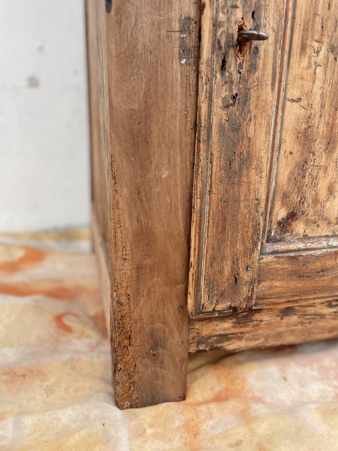 Rustic and vintage wardrobe in raw wood, wabi-sabi style.