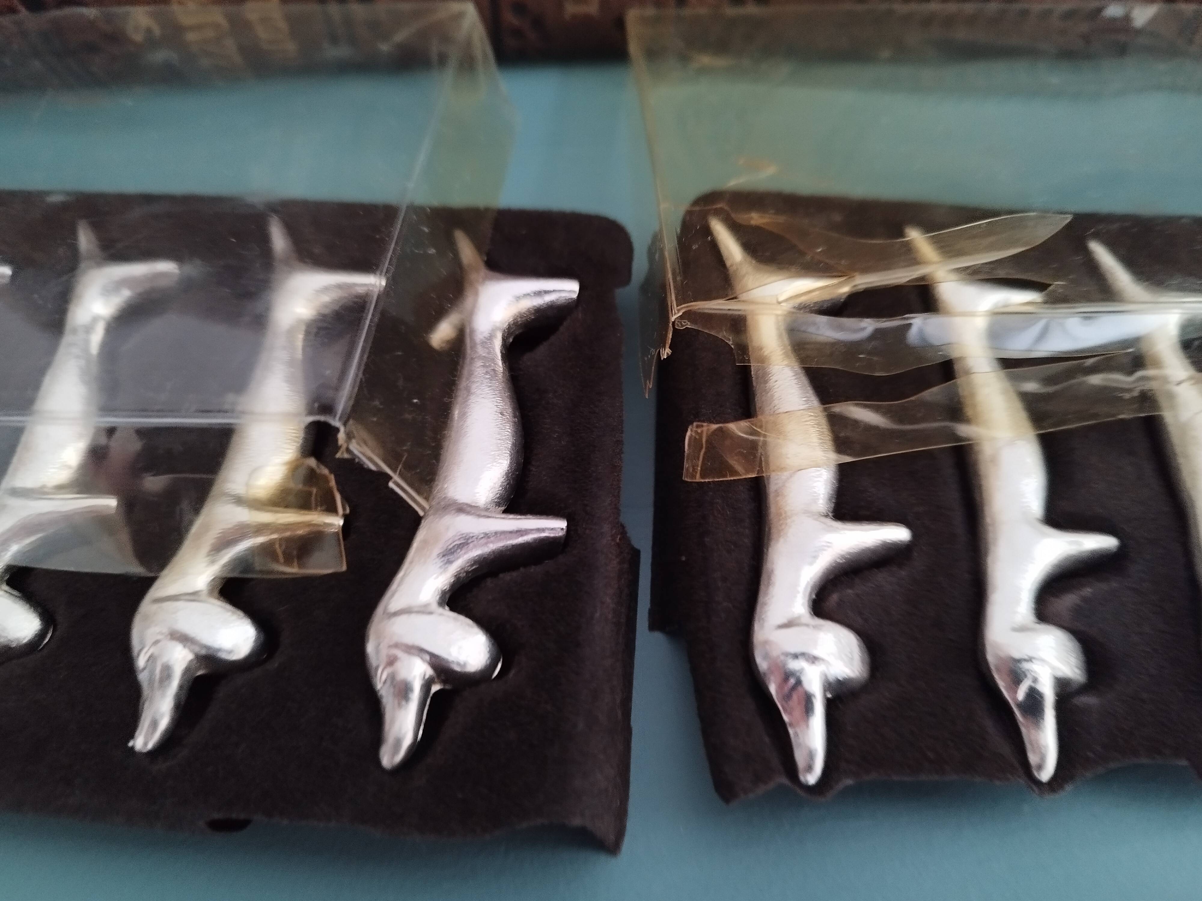 Silver metal knife holders with Dachshund dogs