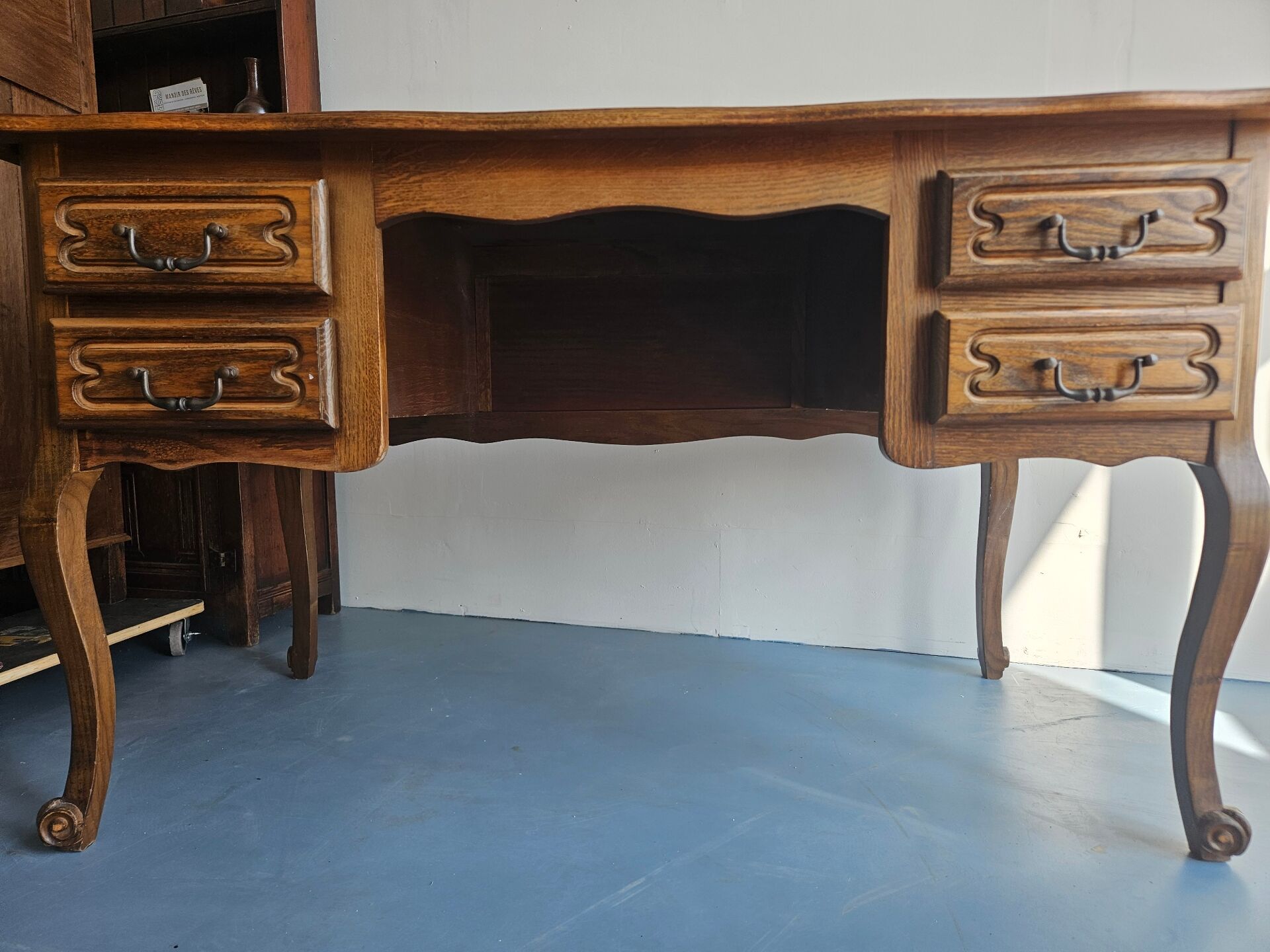 Antique wooden desk with 4 drawers.