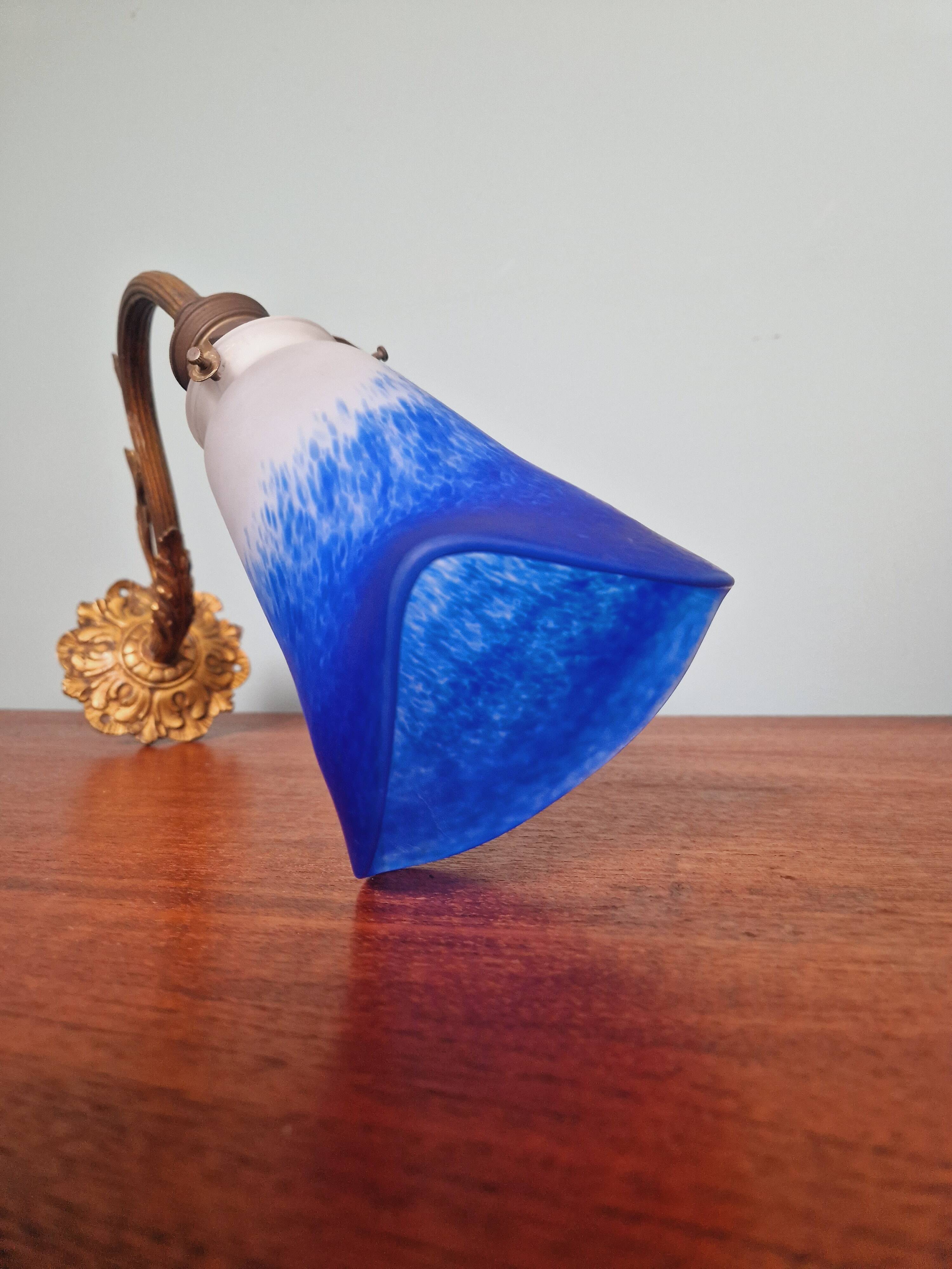 Wall light in gilded bronze and blue marmoreal glass, early 20th century